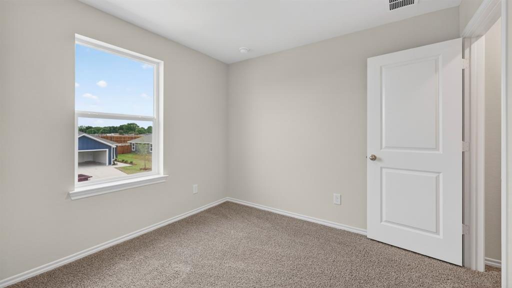3534 Spring Time Street Forney, TX 75126 - Photo 17 of 24 Neutral wall paint with textured carpet flooring