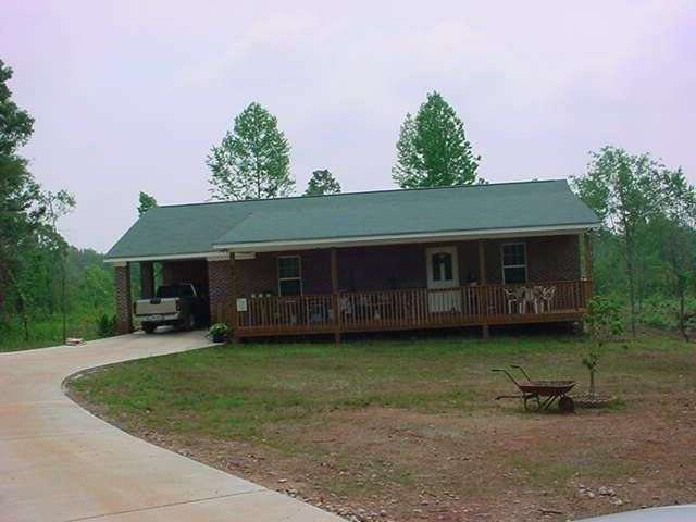 64 Tanyard Road Bowdon, GA 30108 - Photo 1 of 1 a front view of a house with garden