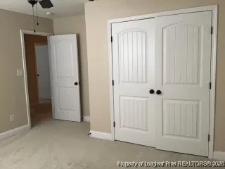 a view of a hallway with closet area