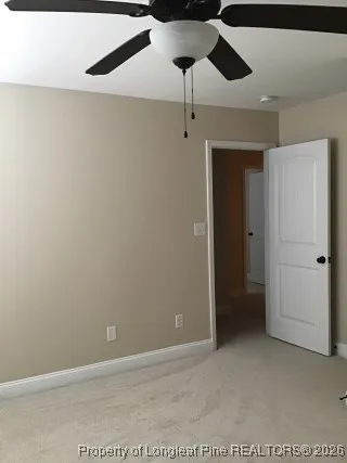 a view of a chandelier fan in a room