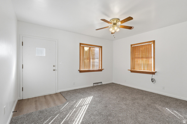 871 North 700 East Logan, UT 84321 - Photo 3 of 20 Entrance foyer featuring a ceiling fan and carpet