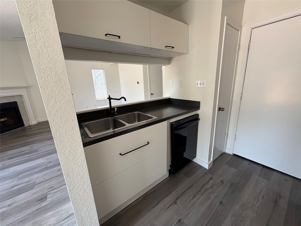 1128 Orchard Park Circle Pflugerville, TX 78660 - Photo 5 of 14 a utility room with wooden floor washer and dryer