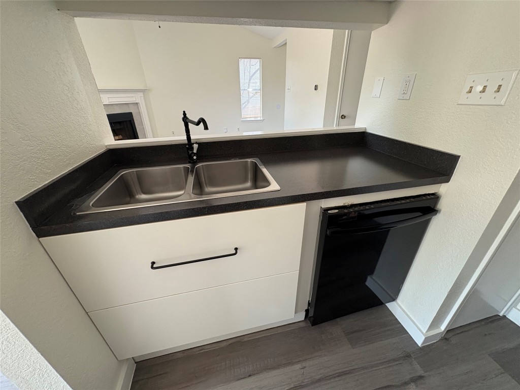 1128 Orchard Park Circle Pflugerville, TX 78660 - Photo 8 of 14 a close view of a sink and cabinets