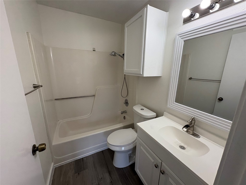 1128 Orchard Park Circle Pflugerville, TX 78660 - Photo 10 of 14 a bathroom with a sink toilet and shower