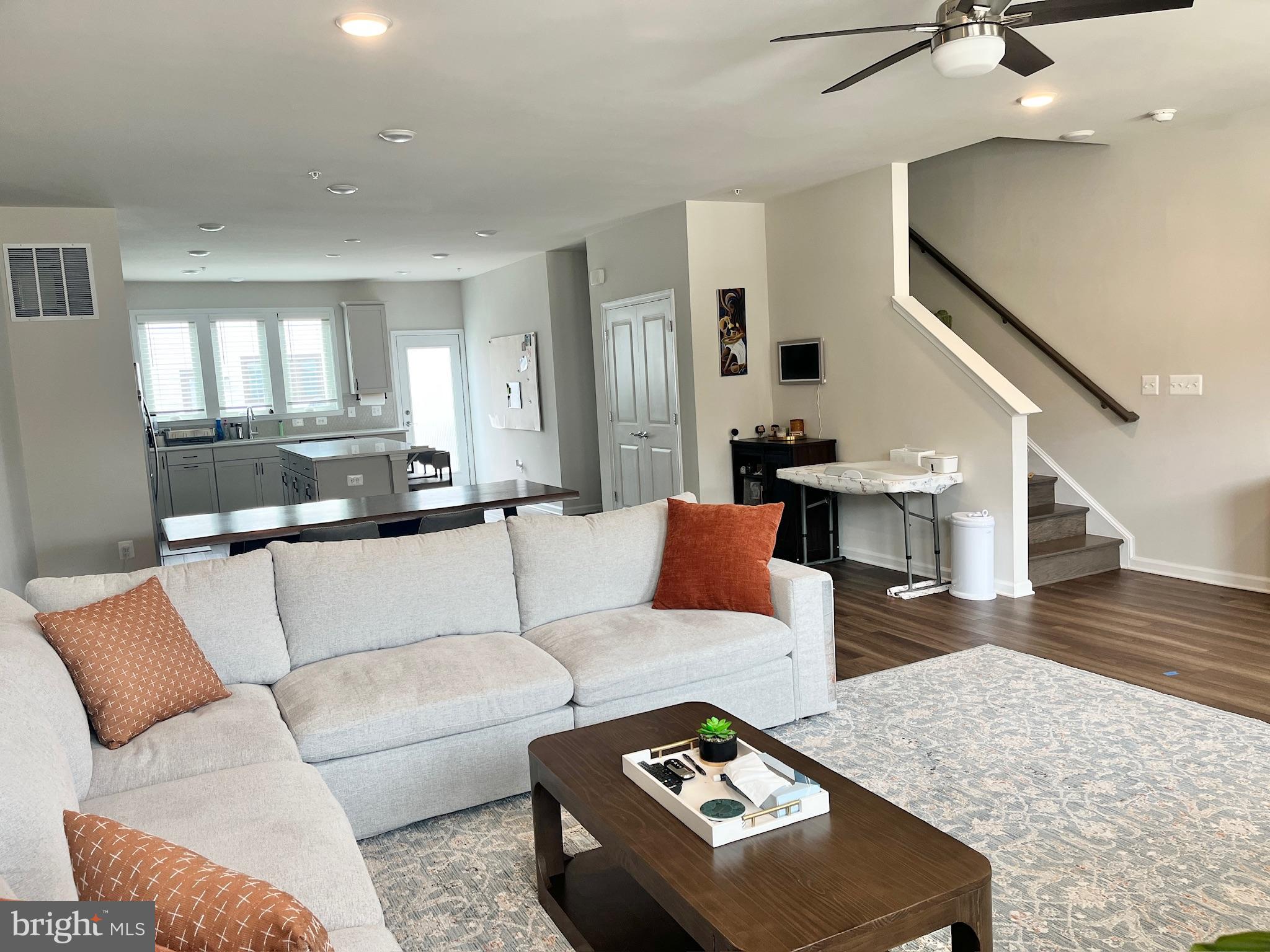 236 Mainstream Drive Laurel, MD 20724 - Photo 12 of 52 a living room with furniture and wooden floor