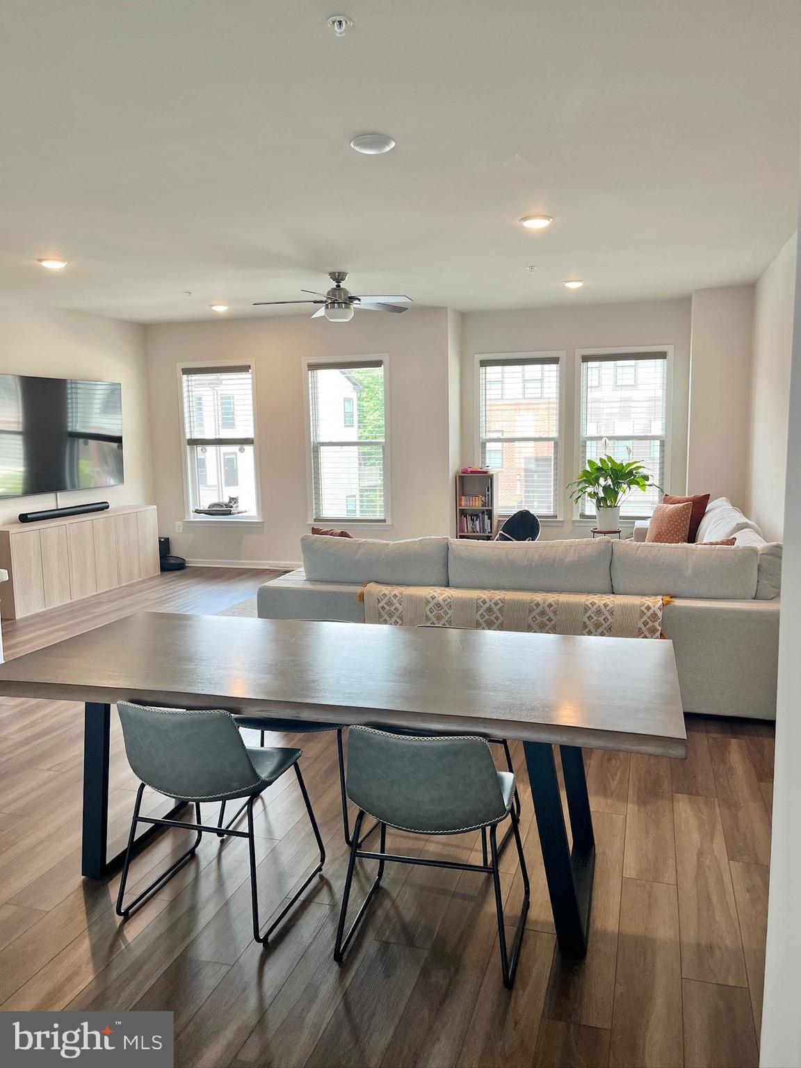 236 Mainstream Drive Laurel, MD 20724 - Photo 16 of 52 a kitchen with a dining table chairs and window