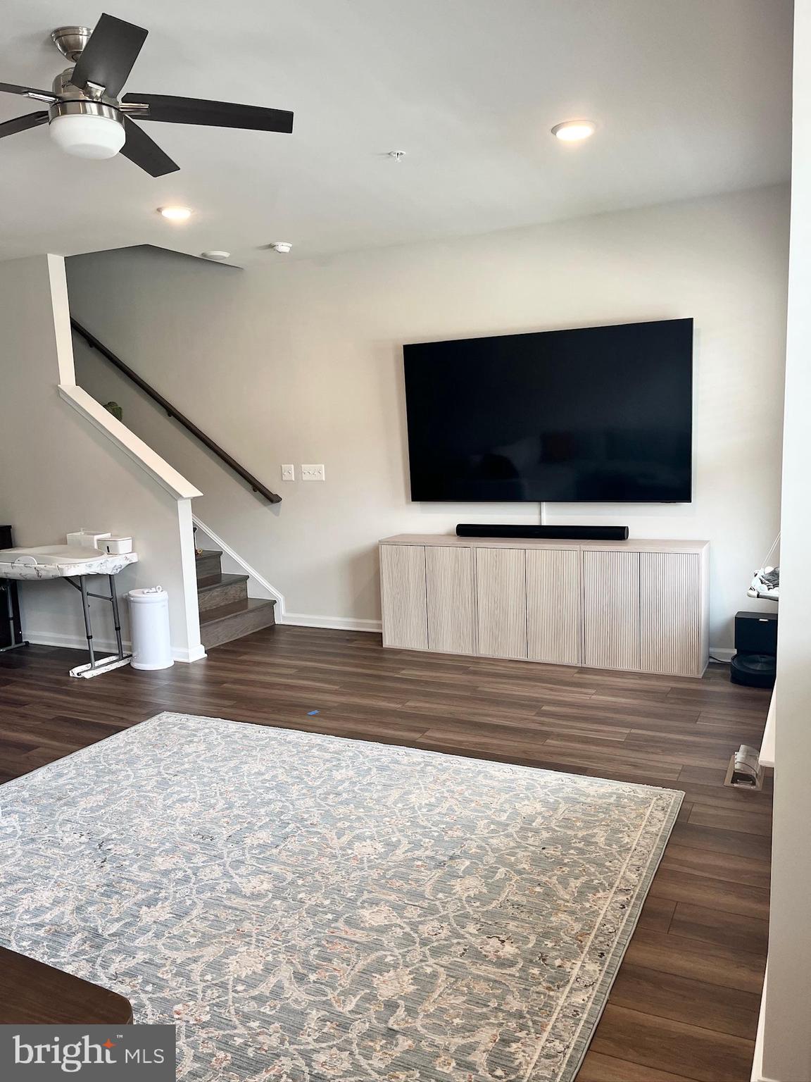 236 Mainstream Drive Laurel, MD 20724 - Photo 18 of 52 a living room with furniture and a flat screen tv