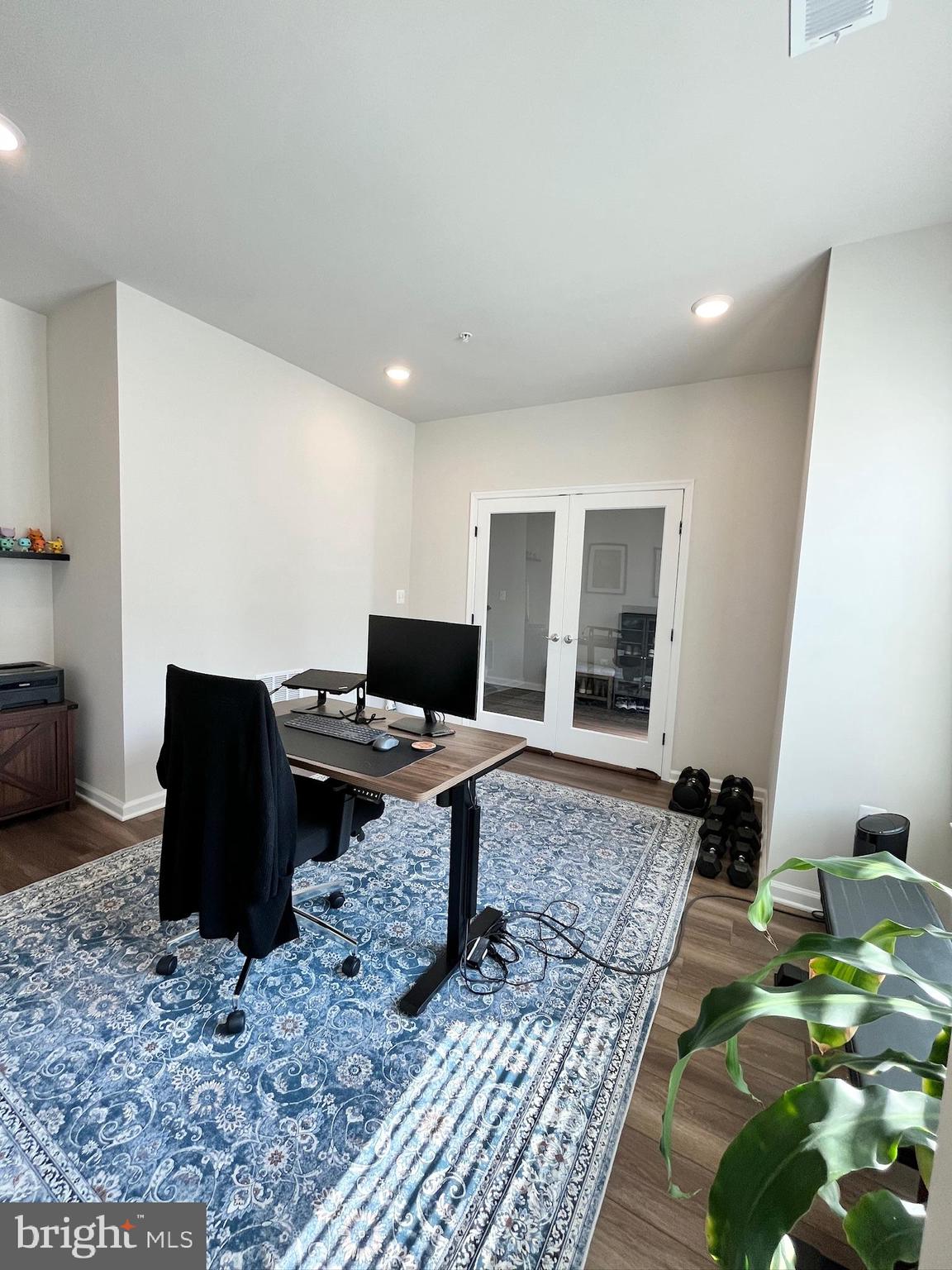 236 Mainstream Drive Laurel, MD 20724 - Photo 21 of 52 a living room with furniture and a flat screen tv