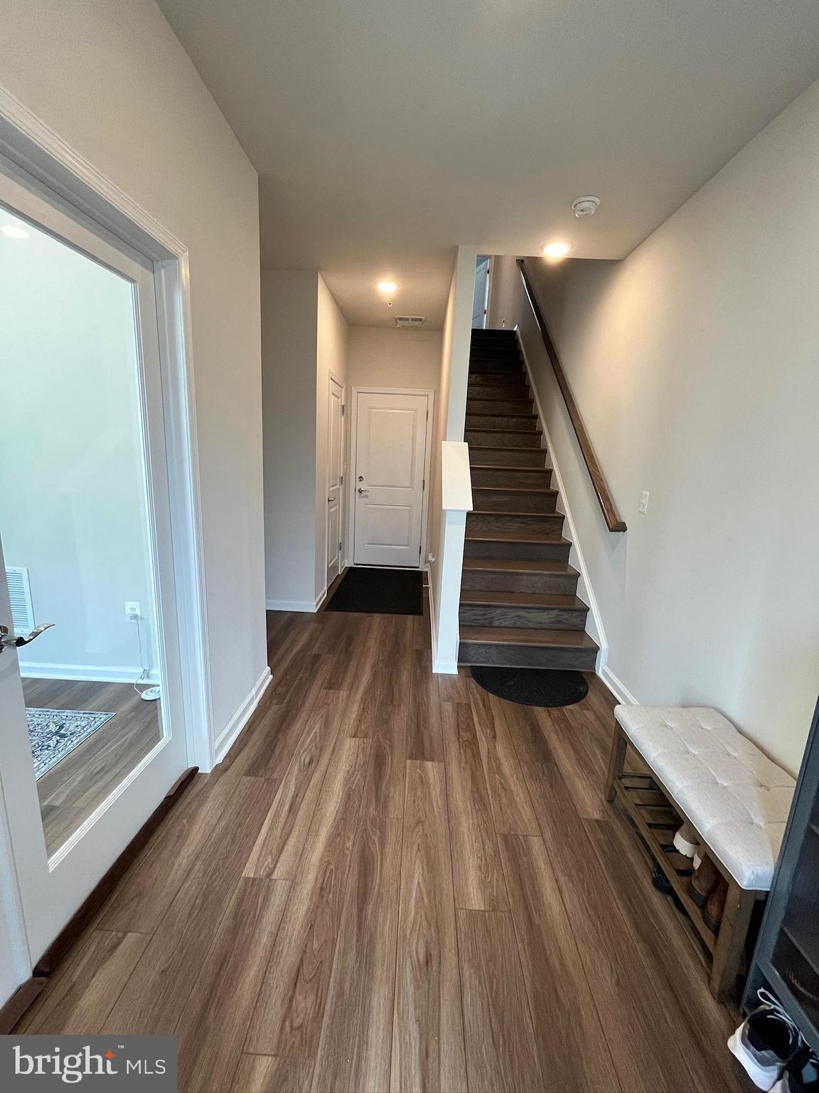 236 Mainstream Drive Laurel, MD 20724 - Photo 23 of 52 a view of a hallway with wooden floor and staircase
