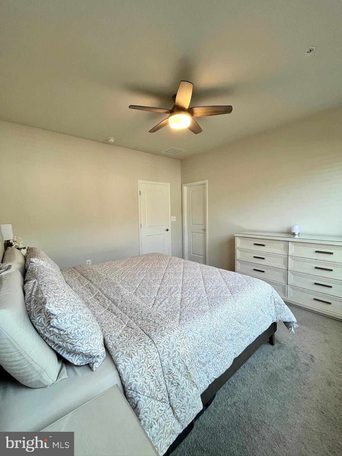 236 Mainstream Drive Laurel, MD 20724 - Photo 24 of 52 a bedroom with a bed and a ceiling fan