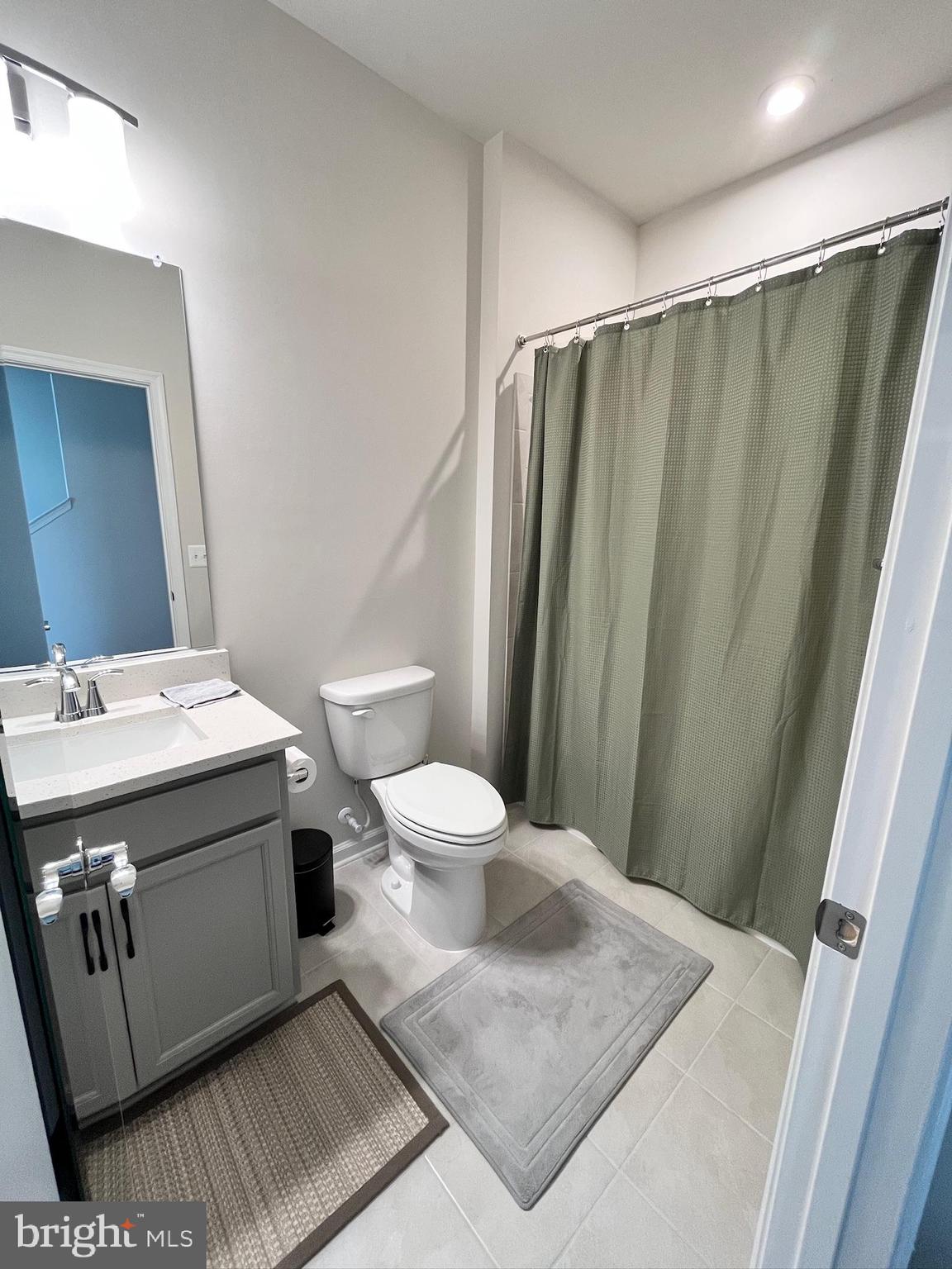 236 Mainstream Drive Laurel, MD 20724 - Photo 29 of 52 a bathroom with a sink and a mirror