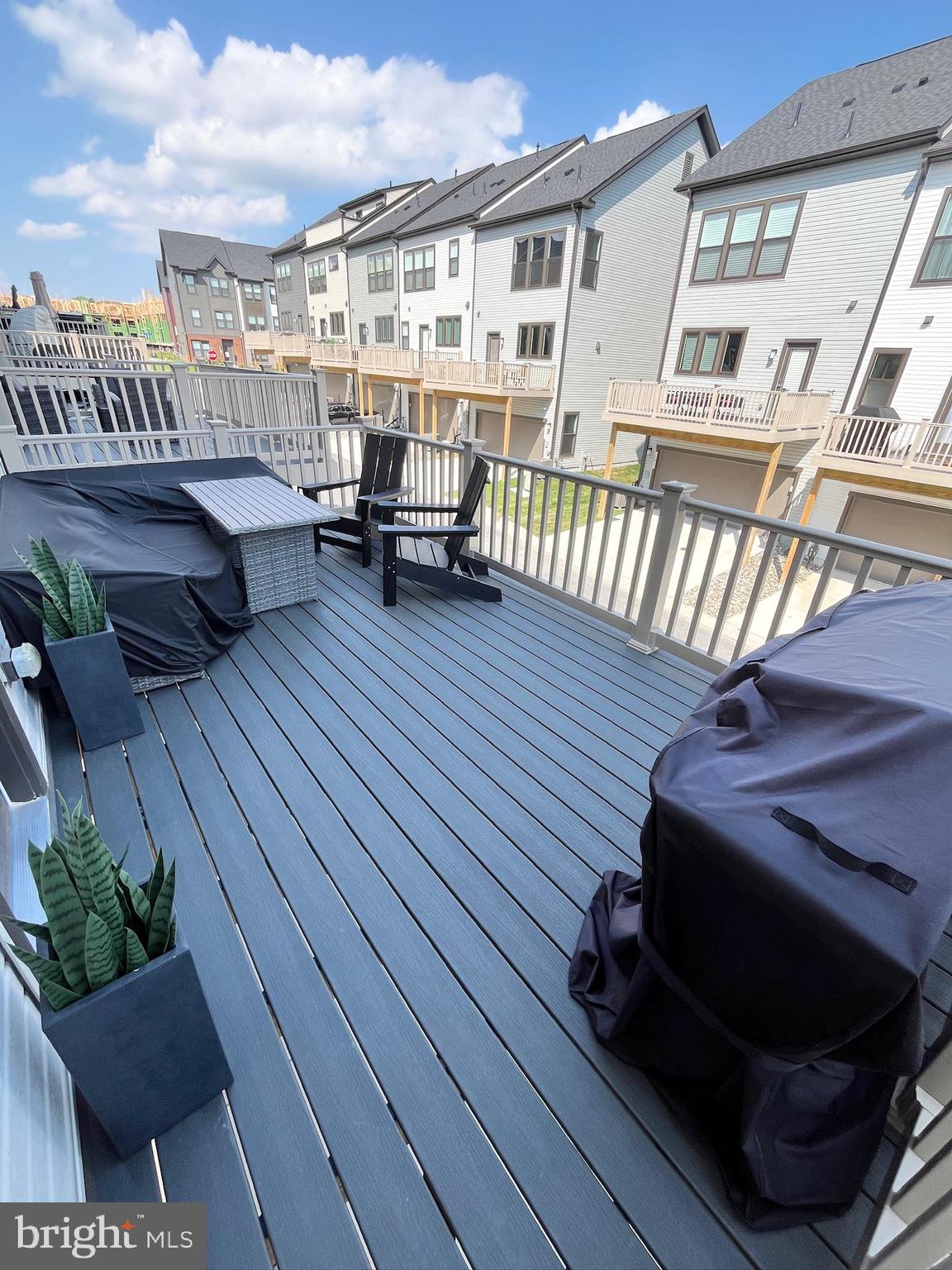 236 Mainstream Drive Laurel, MD 20724 - Photo 3 of 52 a balcony with wooden floors and seating space