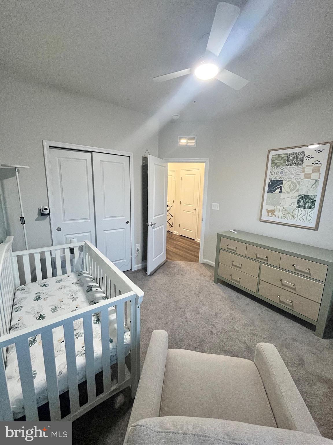 236 Mainstream Drive Laurel, MD 20724 - Photo 32 of 52 a living room with furniture and a baby crib