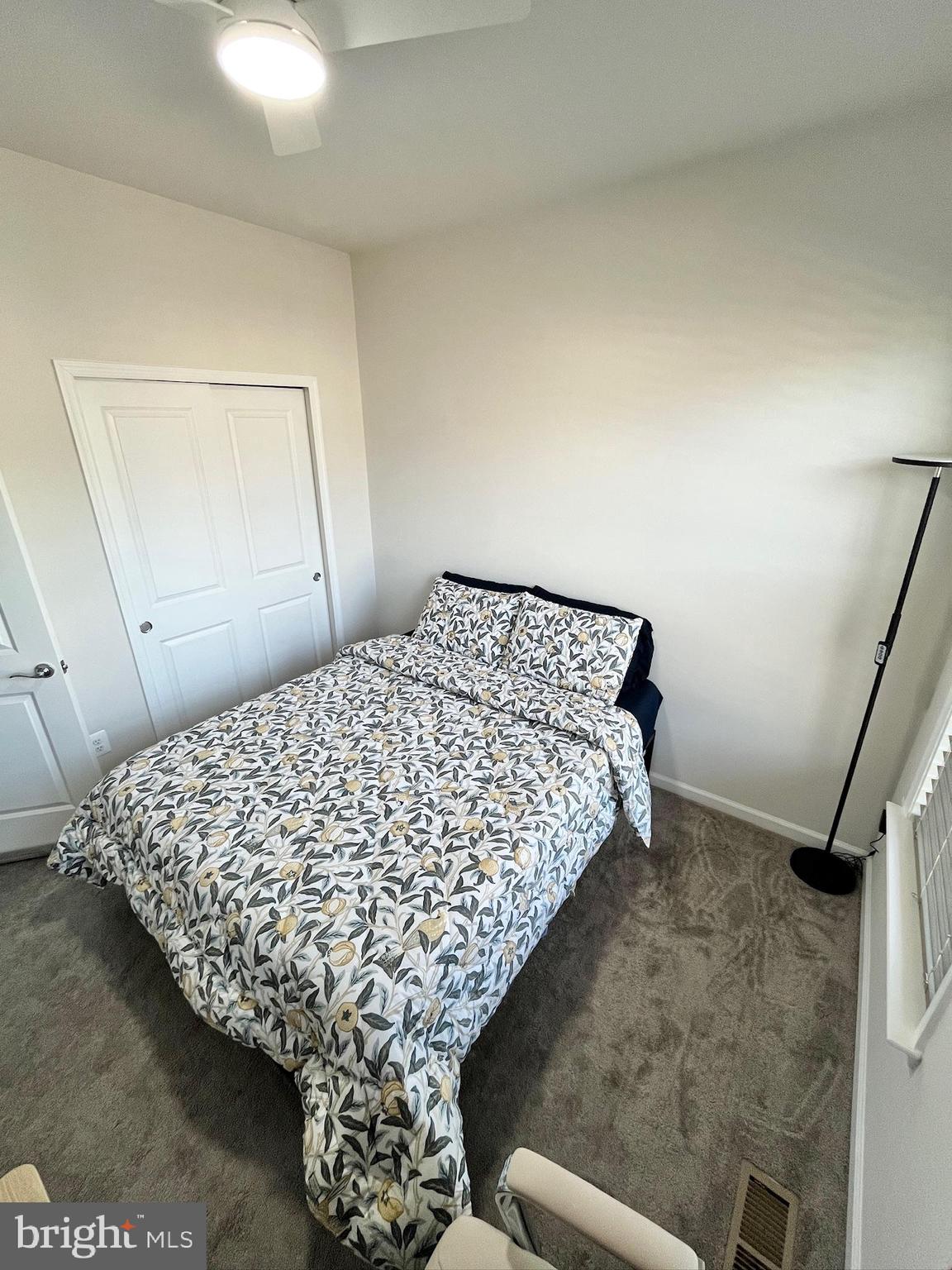 236 Mainstream Drive Laurel, MD 20724 - Photo 42 of 52 a bed sitting in a bedroom next to a window