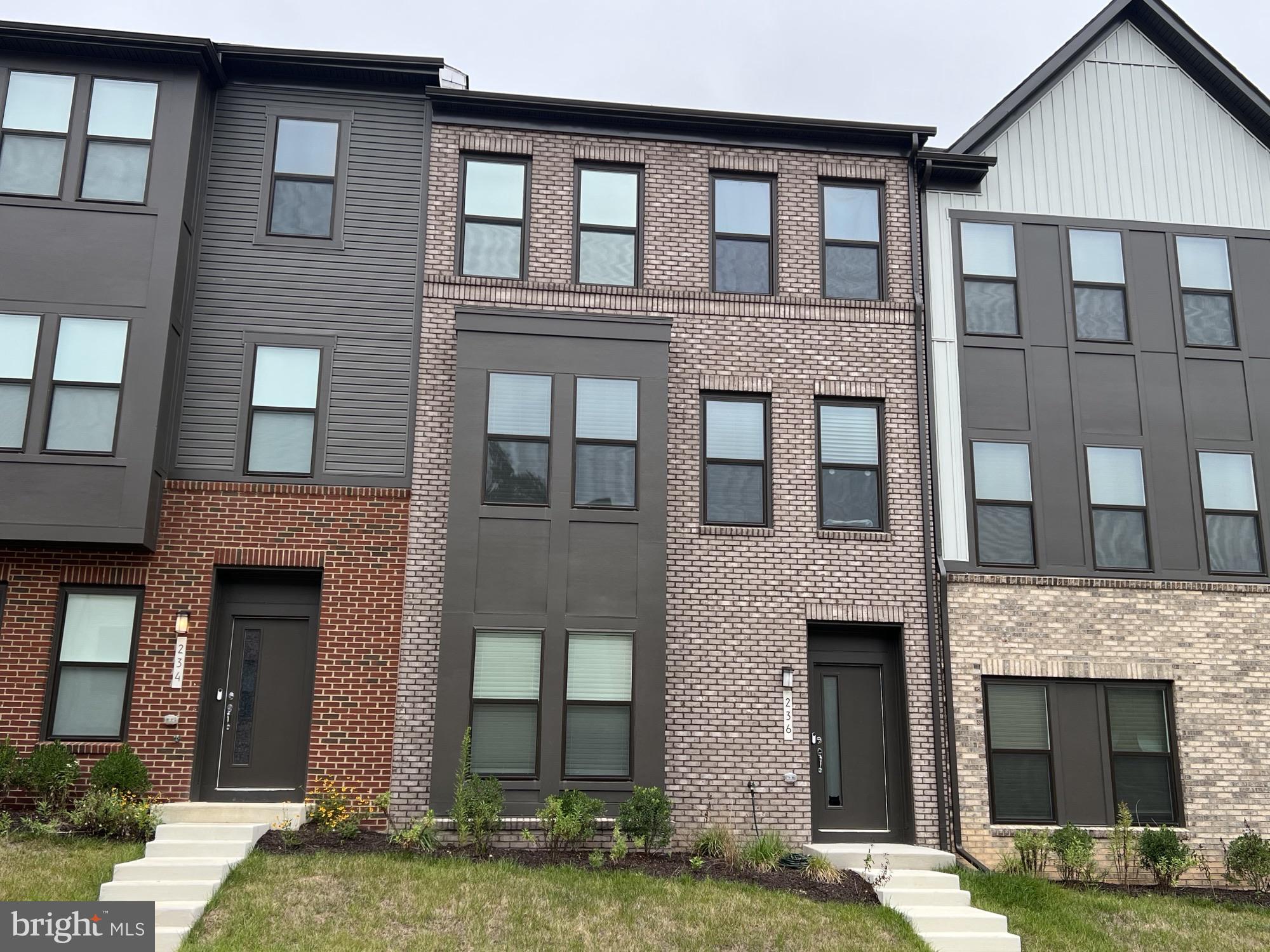 236 Mainstream Drive Laurel, MD 20724 - Photo 43 of 52 a front view of a house with a yard