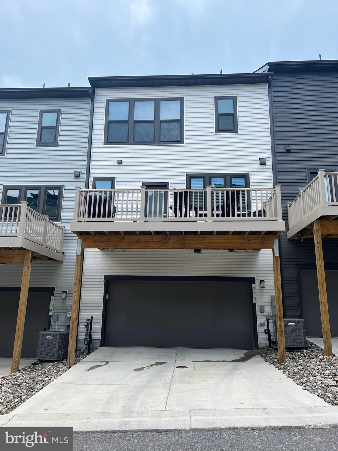 236 Mainstream Drive Laurel, MD 20724 - Photo 46 of 52 a front view of a house with balcony