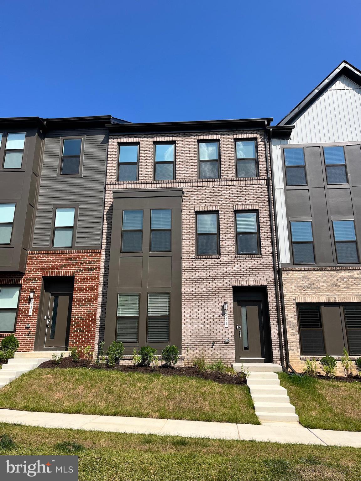 236 Mainstream Drive Laurel, MD 20724 - Photo 51 of 52 a front view of a house with a yard