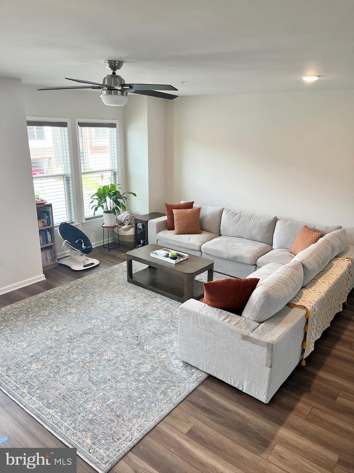 236 Mainstream Drive Laurel, MD 20724 - Photo 9 of 52 a living room with furniture and a rug