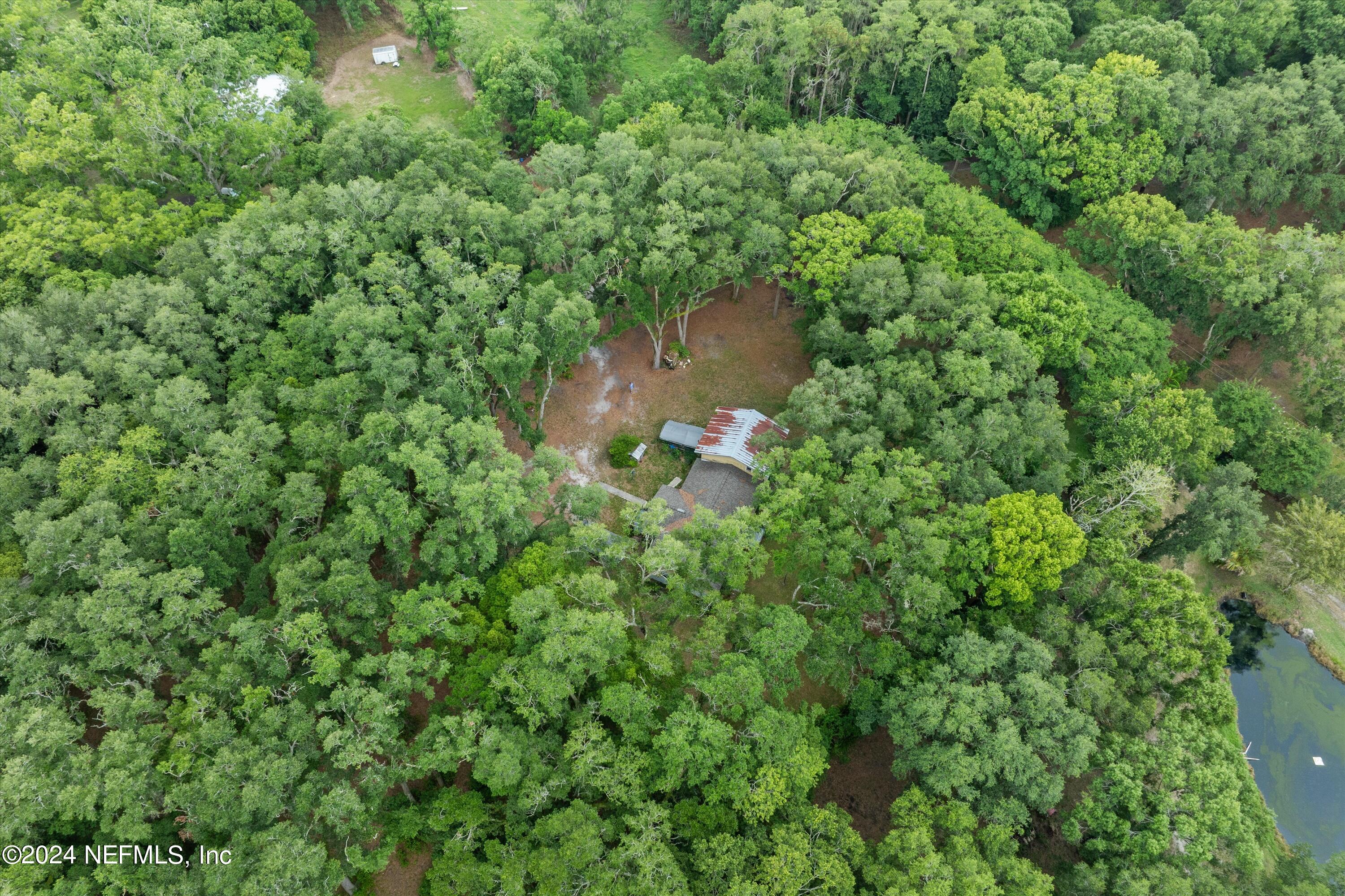 1128 Taylor Road Jacksonville, FL 32234 - Photo 16 of 26 an aerial view of a house with a yard