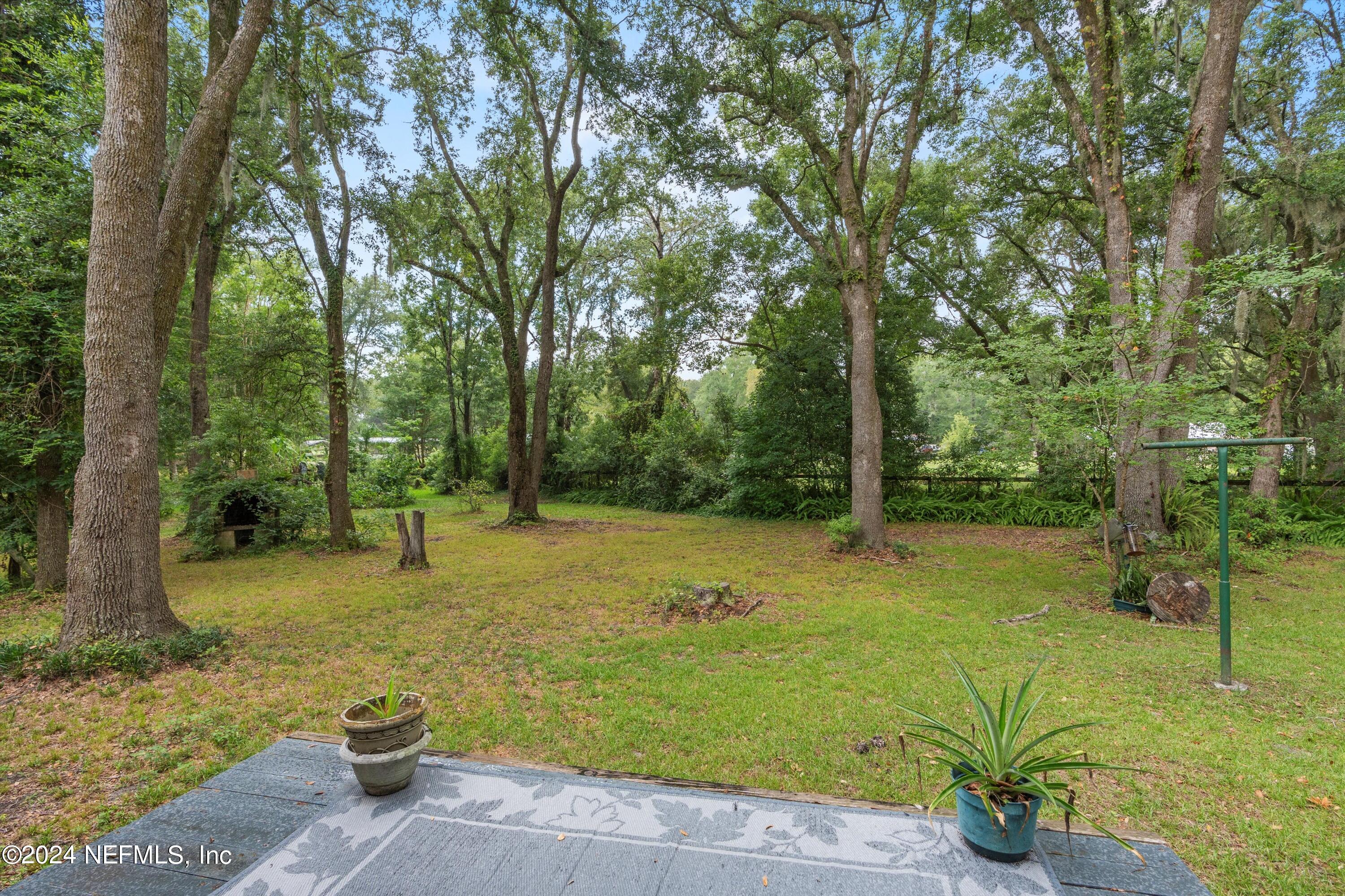 1128 Taylor Road Jacksonville, FL 32234 - Photo 21 of 26 a fire hydrant in the middle of a field