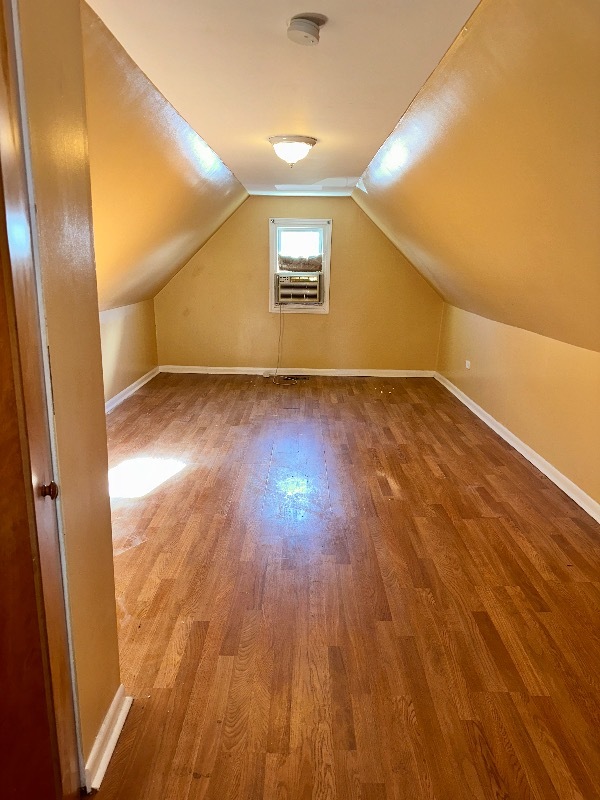 2020 West 69th Place Chicago, IL 60636 - Photo 10 of 12 a view of empty room with wooden floor