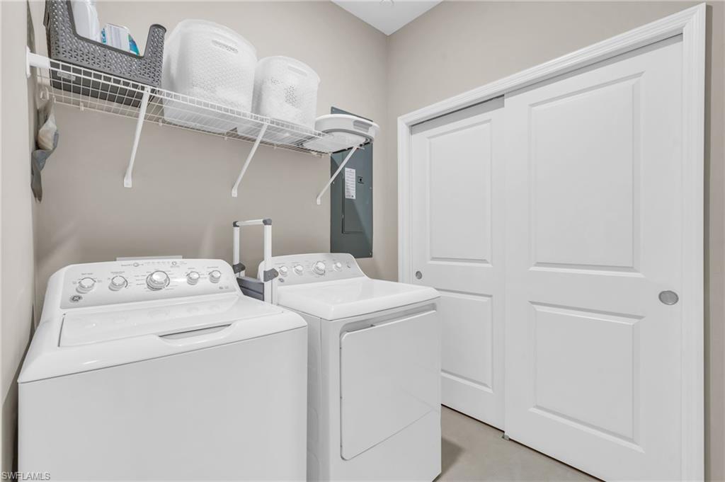 11811 Venetian Lagoon Drive, Unit 202 Fort Myers, FL 33913 - Photo 28 of 50 a utility room with dryer and washer