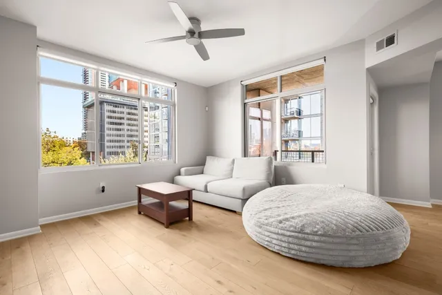 a living room with furniture and a large window