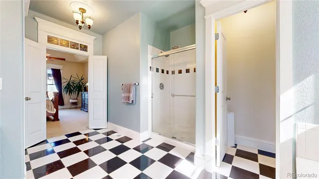a picture of a bathroom with a glass door shower and a bathtub