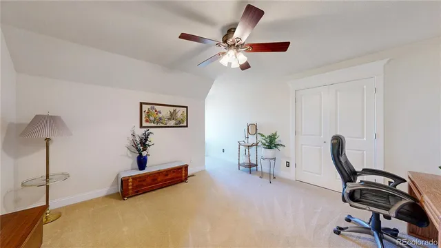 a view of a workspace with furniture and gym equipment