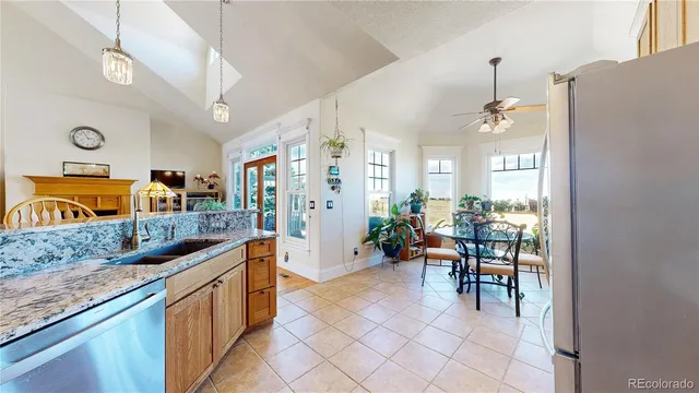 a kitchen with stainless steel appliances granite countertop sink and cabinets