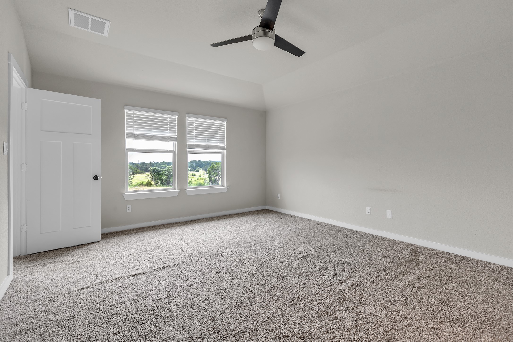 1212 Tipton Street Georgetown, TX 78633 - Photo 9 of 20 A spacious bedroom offers a tranquil retreat with plush carpeting and abundant natural light.