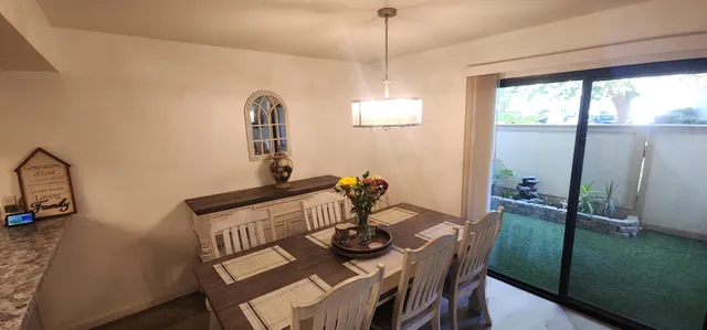 a view of a dining room with furniture window and outside view