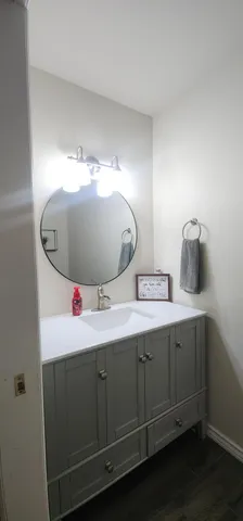 a bathroom with a sink and mirror