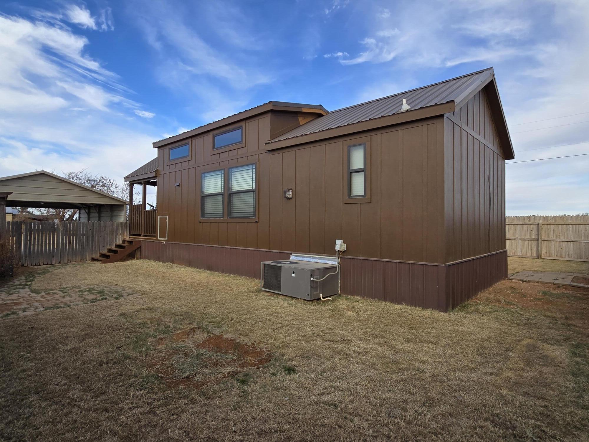 1023 County Road 20 Lamesa, TX 79331 - Photo 18 of 26 a backyard of a house with multiple trees