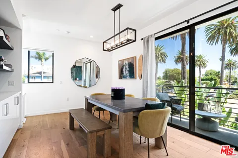 a view of a livingroom with furniture window and wooden floor