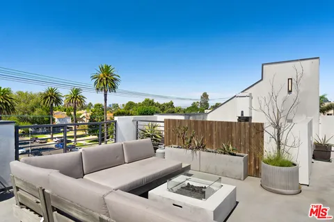 a view of a terrace with furniture