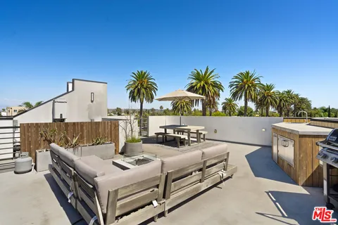 a view of a patio with swimming pool