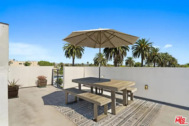 a view of backyard with outdoor seating