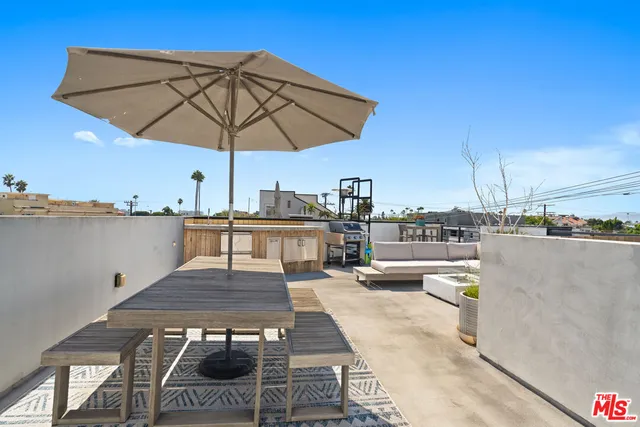 a view of a terrace with sitting area