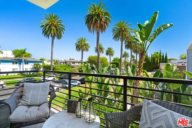 a view of a chairs and table in patio