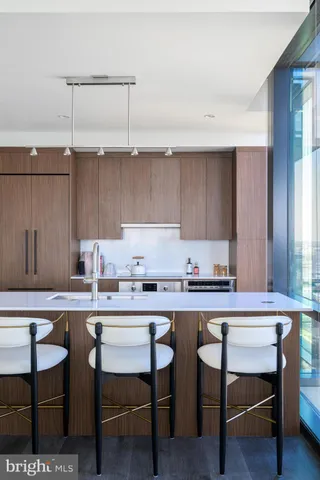 a kitchen with a table and chairs in it