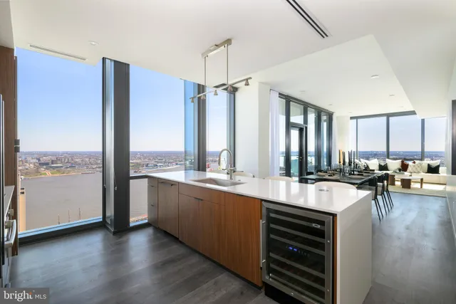 a large kitchen with a large window and counter space