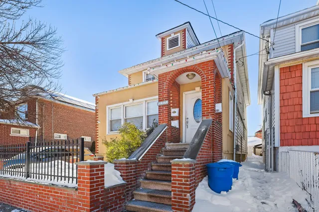 a front view of a house with many windows