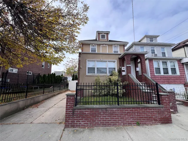 front view of a house with a garden