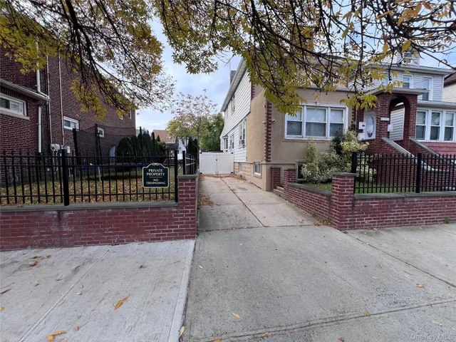 a view of a house with a street