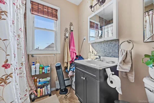 a bathroom with a sink mirror and vanity