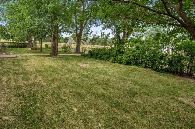a view of outdoor space with deck and yard