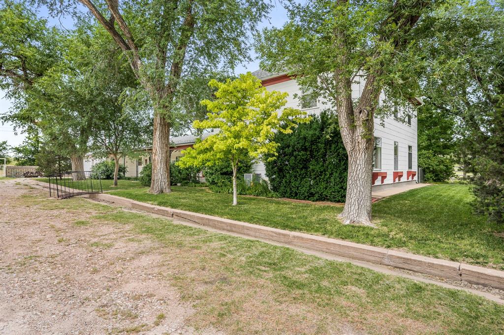 1204 East Cheyenne Avenue Canadian, TX 79014 - Photo 20 of 39 a view of a backyard with large trees