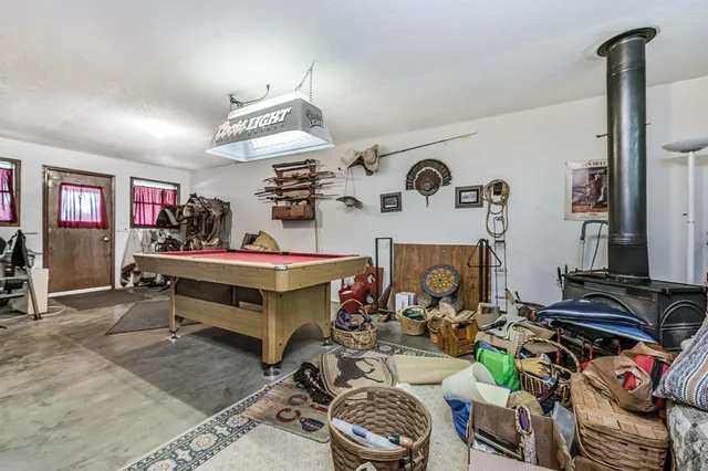 a living room with lots of furniture and white walls