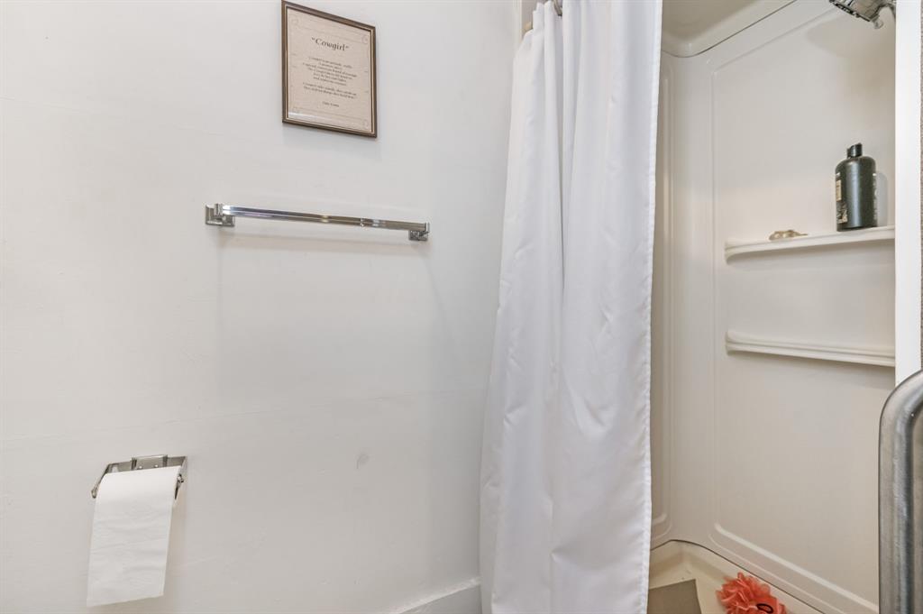 1204 East Cheyenne Avenue Canadian, TX 79014 - Photo 34 of 39 a bathroom with a shower